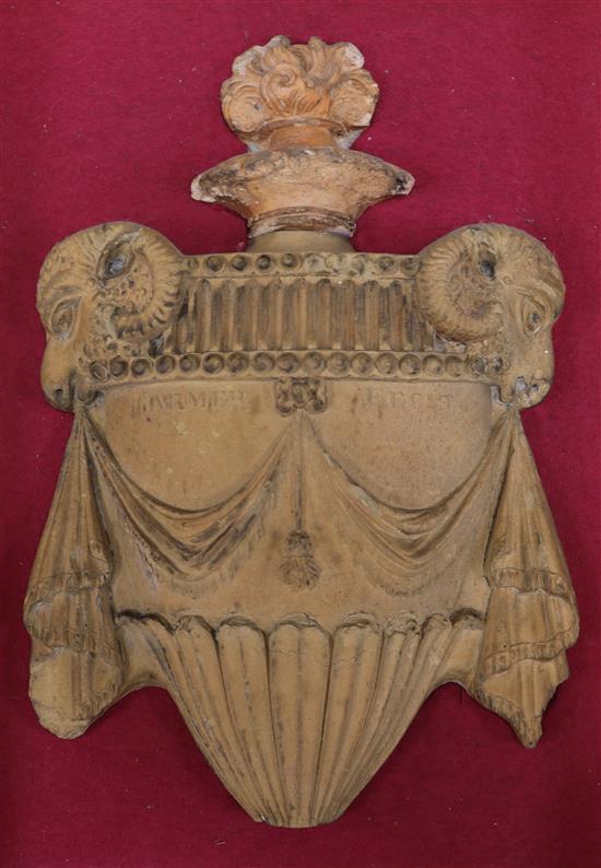 A late 18th/early 19th century terracotta urn shaped wall appliqué, inscribed Harmer Fecit, mounted